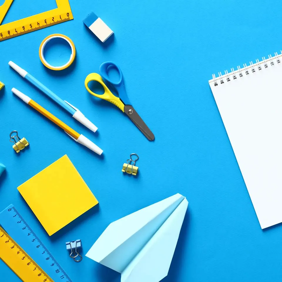 Defining a project with creative tools on a blue desk